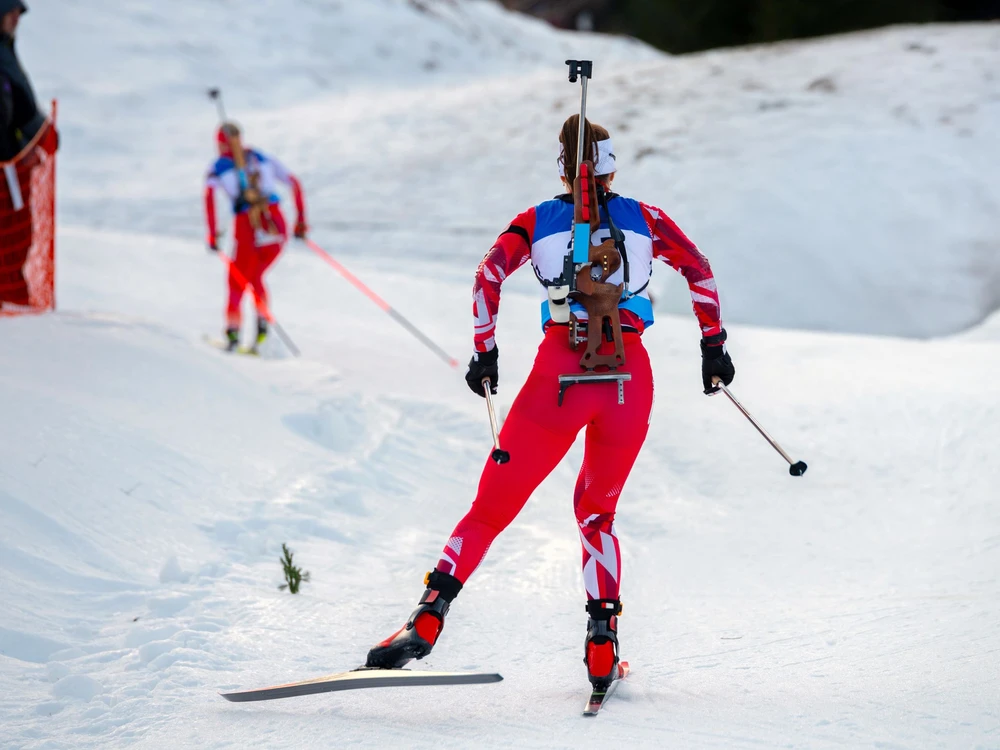 Biathlon athlete on the snowy track while winter sport professional race