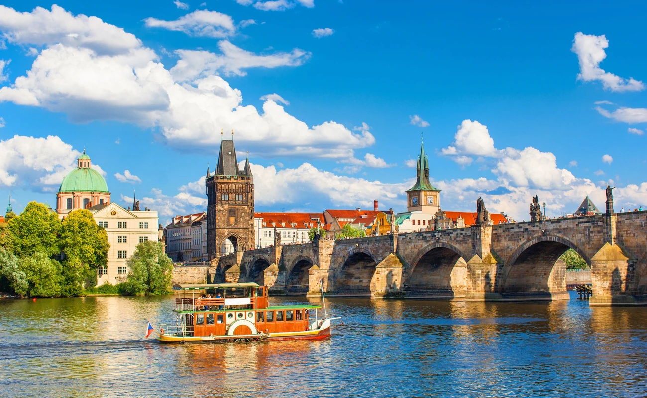 Prague, Czech Republic, Charles Bridge across Vltava river on which the ship sails