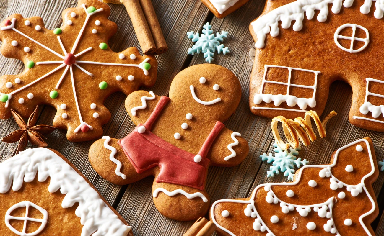 Christmas homemade gingerbread cookies on wooden table