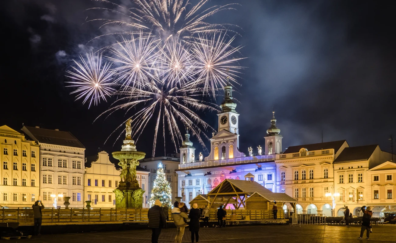 Fireworks celebrating New Years Eve above historical square in old town in Ceske Budejovice, Czech Republic