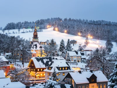 Illuminated houses in Seiffen at Christmastime. Saxony, Germany