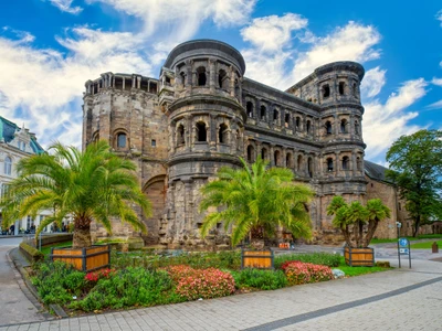 Amazing view of famous Porta Nigra (Black gate) - ancient Roman city gate in Trier, Germany. It is today the largest Roman city gate north of the Alps. UNESCO World Heritage Site.