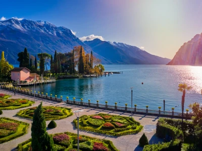 Beautiful and colorful autumn in Riva del Garda,Panorama of the gorgeous Garda lake surrounded by mountains in the autumn time